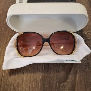 OAKLEY BLACK AND GOLD FRAME BROWN LENS SUNGLASSES